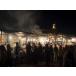 People eating at one of the stalls in Jemaa el-Fna at night Marrakesh Moroc