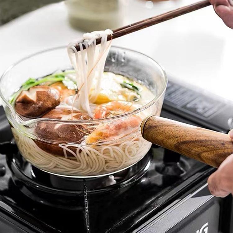  food ingredients . is seen glass saucepan heat-resisting glass desk saucepan home use 600ML glass cooking pot glass soup saucepan food ingredients . is seen glass saucepan cover attaching glass cover direct fire oven 