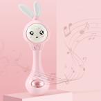 漫画のウサギの赤ちゃんがガラガラハンドベル音楽ライトティーザーおもちゃピンクを振る