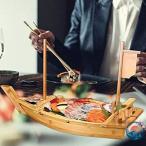  суши лодка лодка пик контейнер sashimi тарелка суши . шт. sashimi пик тарелка река лодка . армия лодка . есть тарелка обеденная тарелка . sashimi . мясо еда японская посуда большая тарелка кулинария судно . структура .