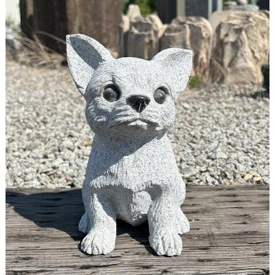 犬の石材置物 足を突き出したデザイン 犬の石材置物 足を突き出した
