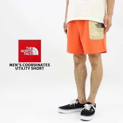 THE NORTH FACE メンズショート、ハーフパンツ（色：オレンジ系