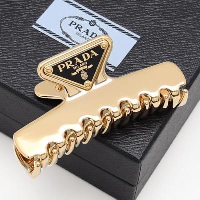 PRADA レディースヘアアクセサリー（色：ゴールド系）｜ファッション