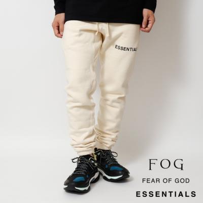 Fear of god ESSENTIALS アイボリー ワークパンツ Fear of God ESSENTIALS BONDED ワークパンツ - Timber | REVOLVE