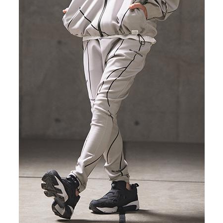 【GLIMCLAP(グリムクラップ)】Tight fit track pants -geometri...