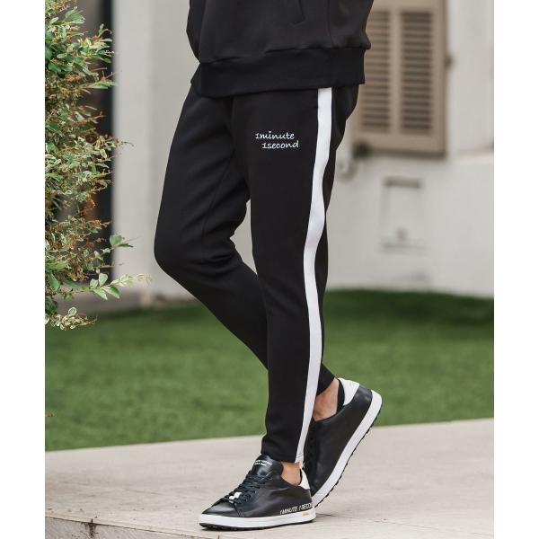 cardboard knit line pants with cursive embroidery ...