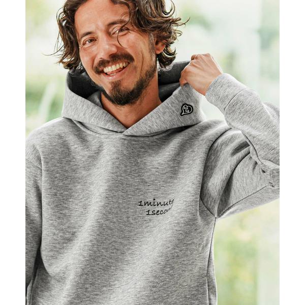 cardboard knit parka with cursive print