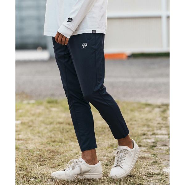 イージーパンツ cursive embroidery nylon jersey pants