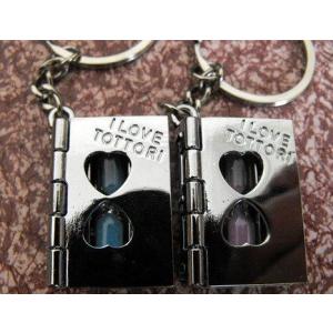 ノーブランド品ペアキーホルダー ブック型 砂時計入り