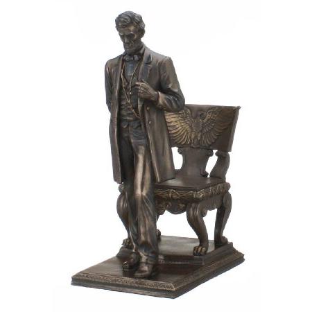 Abraham Lincoln Figurine Standing near Chair with ...