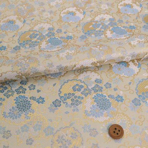 金襴生地(金らん) 重ね雪輪に唐草花尽くし(白/水色) 10cm単位 切り売り