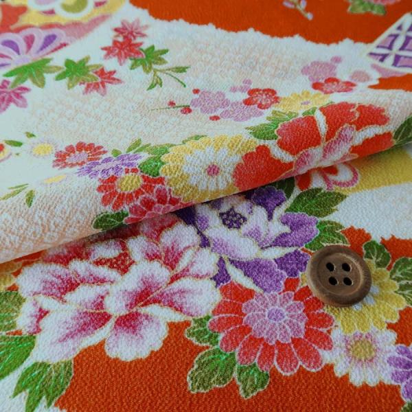 一越ちりめん かのこ雲に百花扇柄(オレンジ) 10cm単位 切り売り
