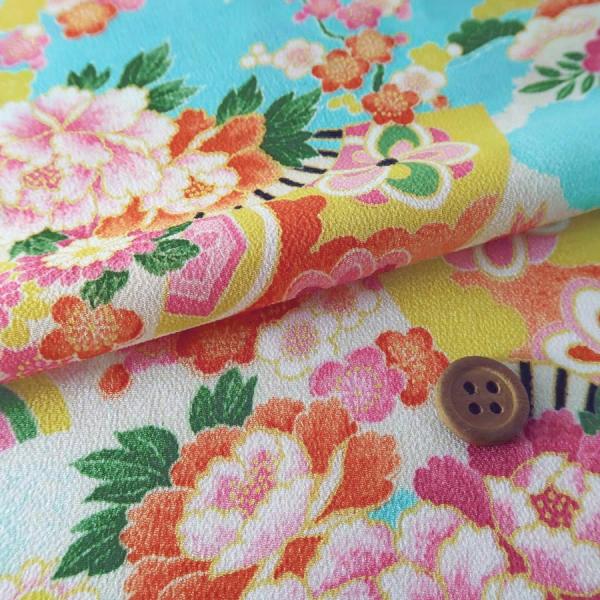 一越ちりめん かのこ雲に百花扇柄(水色) 10cm単位 切り売り