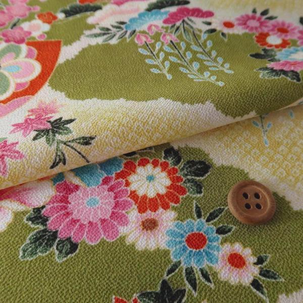 一越ちりめん かのこ雲に百花扇柄(黄緑) 10cm単位 切り売り