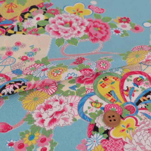 ポリちりめん生地 花御所車の雅び(水色) 10cm単位 切り売り