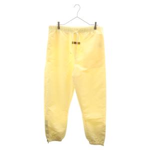 FOG Essentials フィアオブゴッド エッセンシャル NYLON TRACKPANTS ラバーロゴ ナイロンパンツ ドローコードトラックパンツ イエロー｜shopbring