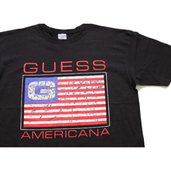 90s USA製 GUESSゲス AMERICANA 星条旗 コットンTシャツ 黒 OSFA★オール...