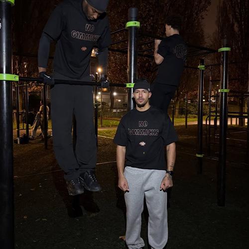 SYNA WORLD NO GIMMICKS TEE 【BLACK / ROSE GOLD】