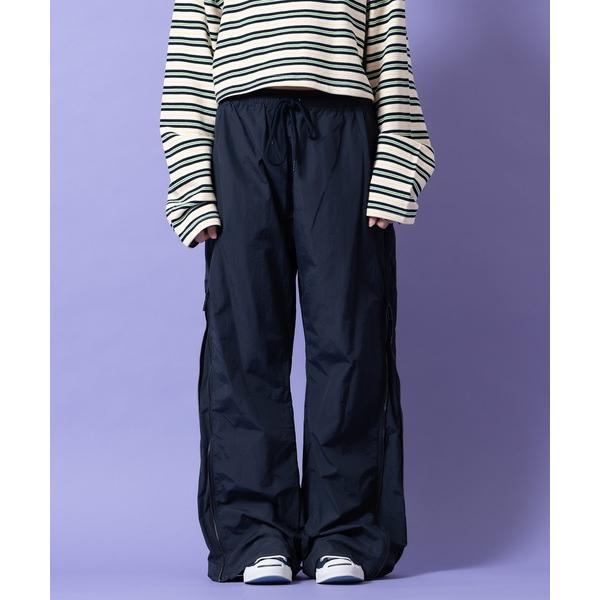 パンツ a.p.o.v. サイドジップ変形ワイドフレアナイロントラックパンツ メンズ レディース