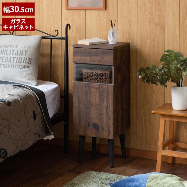 木製 北欧 隙間収納 扉付き 脚付き リビングボード 一人暮らし 新生活 シンプル モダンヴィンテージ感漂う深みのあるブラウンをベースに透明感あるクリアガラスやスキニーな美脚効果で軽やかでスタイリッシュなデザインに仕上げたFAX台兼用キャビ...