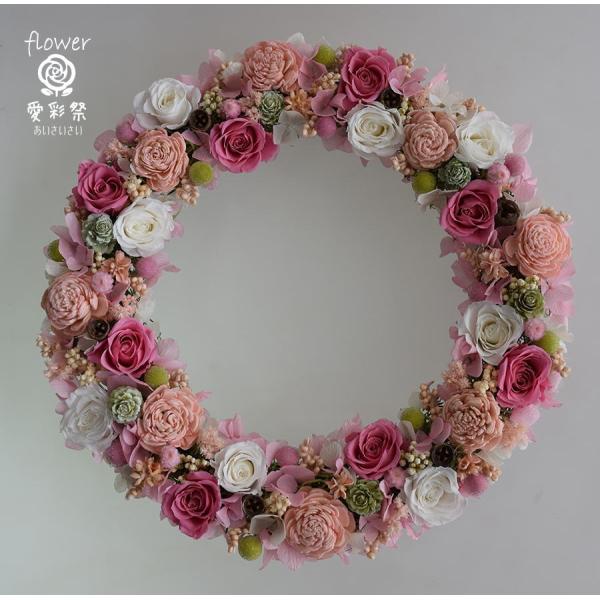 仕上がりサイズ　27cm　＜ベース　木　25cm＞ピンク・白のバラのプリザーブドフラワーリースです。大人ピンクの色合い、甘すぎないピンク系です。