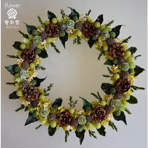 29cm＜ベース　木　25cm＞アイビーの葉っぱと木の実のリース。葉はプリザーブド加工なので色褪せもなく、クリスマスを過ぎても飾っていただけます。クリスマスリース、お花のクリスマスリース、バリエーションがいろいろございます。↓の画像をクリッ...