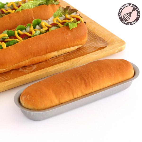 使い込むほど使いやすくなる業務仕様のアルタイト製ホットドッグ型です。材質 ：アルタイトサイズ ：内寸約200(176)X55(34)XH26mm取扱方法・その他注意事項 初めて使用する前に洗って水分を拭き取り、空焼きをして下さい。【空焼き目...