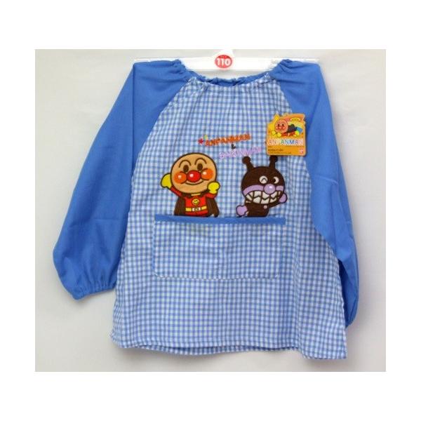アンパンマン　スモック　ポケット付き男の子カラー：ブルー　チエック柄サイズ：１００サイズ： 胸囲：４９−５５cm        １１０サイズ： 胸囲：５３−５９cm素　材：チエック部分、綿１００％　　　　無地部分、ポリエステル９５％、綿５％...