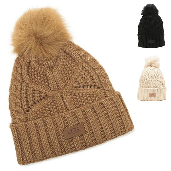 アグ 帽子 ケーブルビーニー ウィズ ポン レディース UGG 10089 W CABLE BEANIE WITH POM なめらかでソフトなウールブレンドを使用したニット帽。美しい蝶のパターンにポンポンをあしらい、可愛らしく仕上げました。...