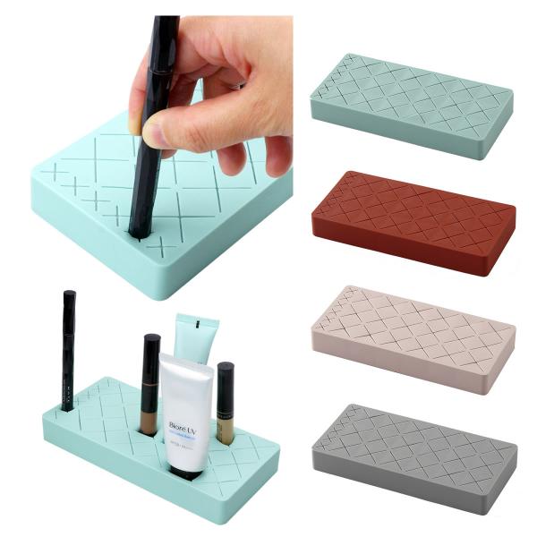 立ててコスメを整理整頓！シリコンスタンド挿し込むだけで収納完了！バラバラになりやすい化粧品を立てて収納。簡単に整理整頓！引き出しや机の上など便利に収納。商品サイズ：約19cm×約9cm×厚さ約2.5cm重量：約156g素材：シリコン（カバー...