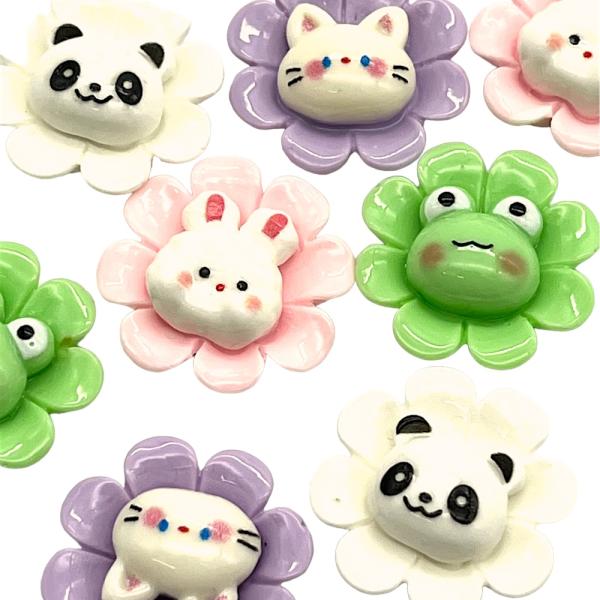 ご覧になって頂きありがとうございます。4種類の動物が花の中心に貼り付けてあり、とてもユニークです。後ろが平らになっておりますのでヘアゴムや、飾りつけなどつけやすいです。【内容数】同タイプ2個【サイズ】約2.5cm×2.5cm厚み9mm （多...