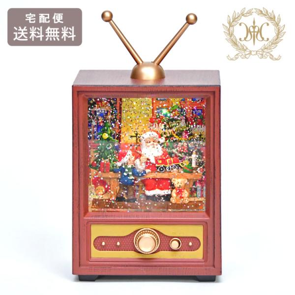 レトロデザインのテレビの中は、クリスマスムード満点のお部屋でくつろぐサンタクロース★スイッチを入れるとクリスマスキャロルがメドレーで流れ、TV画面の中にラメが舞い上がります！棚上やデスクに飾りやすいサイズで、クリスマスプレゼントにもおすすめ...