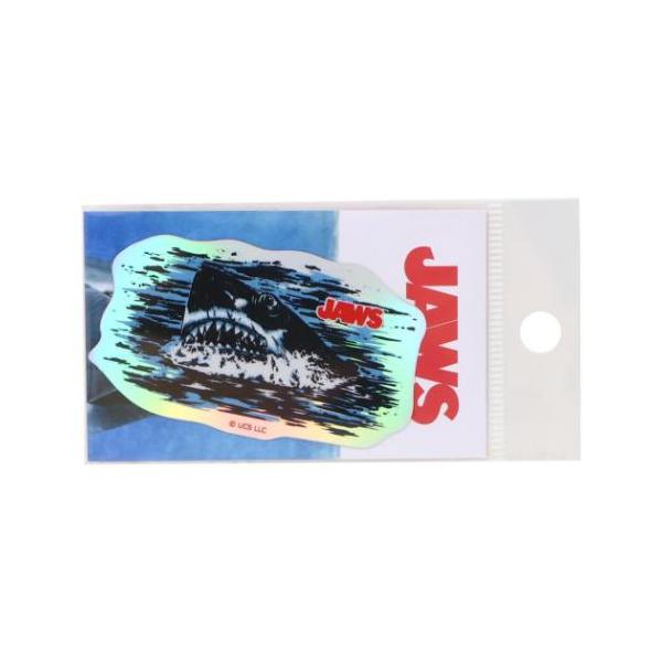「ステッカー：キャラクター」 ダイカットシール ジョーズ ホログラムステッカー 02 自転車やパソコンいろんなところに貼って楽しい耐水ステッカー 人喰いサメが襲うパニックムービー[JAWS/ジョーズ]がグッズになって登場こちらは定番人気アイ...