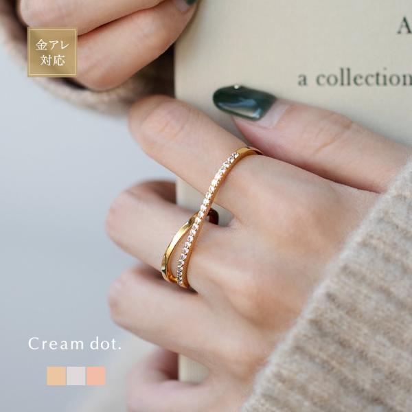 煌めくビジューラインのダブルフィンガーリング。2本の指を繋ぐ存在感抜群なレイヤード風デザイン。シンプルながらも目を惹く今っぽデザインで、ひとつは持っておきたい主役級アイテムです。■サイズリング幅 0.2cm〜0.6cmリングサイズ（内径）※...