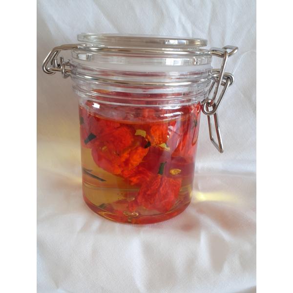 激辛唐辛子ドラゴンズブレスのオイル漬け　２５０ｍｌオイルも実も料理に使えますオイルはサラダ油（キャノーラ湯）使用辛さ２４８万スコヴィルのドラゴンズブレス実は手袋着用にてお取り扱いください定形外郵便でお送りいたします