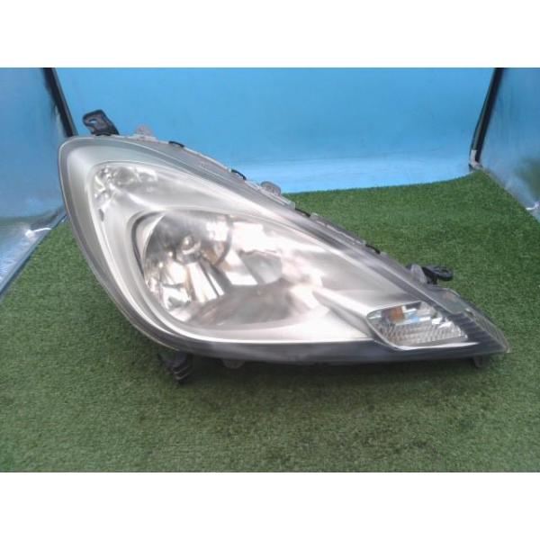 フィット DBA-GE6 右ヘッドライト G 10THアニバーサリー NH731P