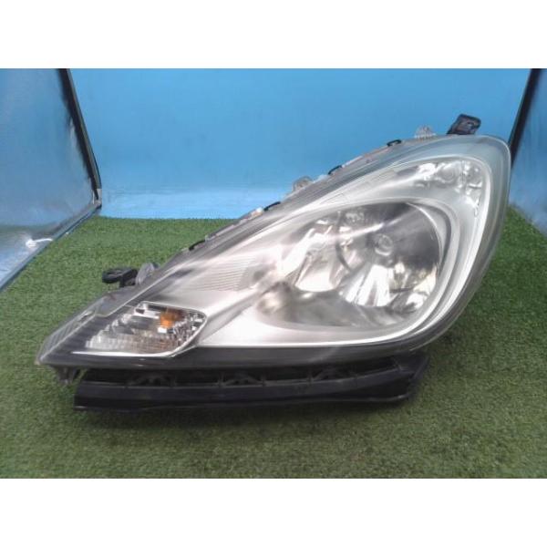 フィット DBA-GE6 左ヘッドライト G 10THアニバーサリー NH731P