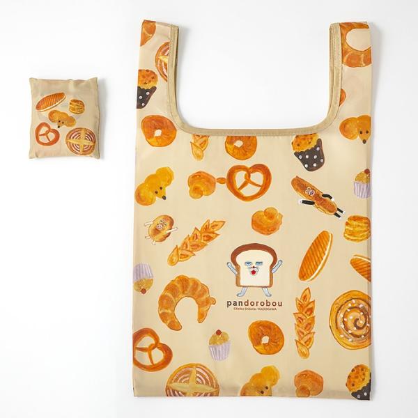 大人気絵本『パンどろぼう』のエコバッグ（Lサイズ）です。『パンどろぼう ほかほかギフトボックス』の表紙のイラストと、絵本の中に登場するパンがたくさん散らばめられたデザインです。どのパンもとってもおいしそうで、パンどろぼうがパンに魅了される気...