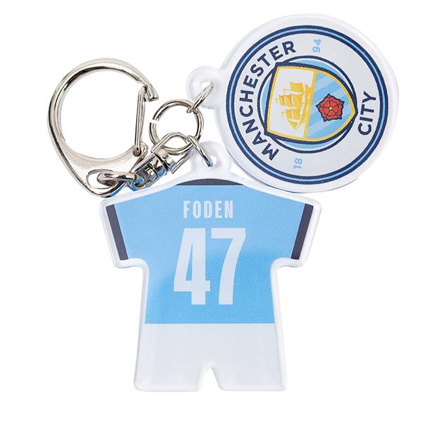 プレミアリーグ マンチェスターシティのクラブエンブレムと『#47 フォーデン』のネーム&amp;ナンバー付きユニフォーム型のアクリル2連チャーム。【素材】アクリル、金属【サイズ】ユニフォーム部：4×4cmエンブレム部：3×3cm