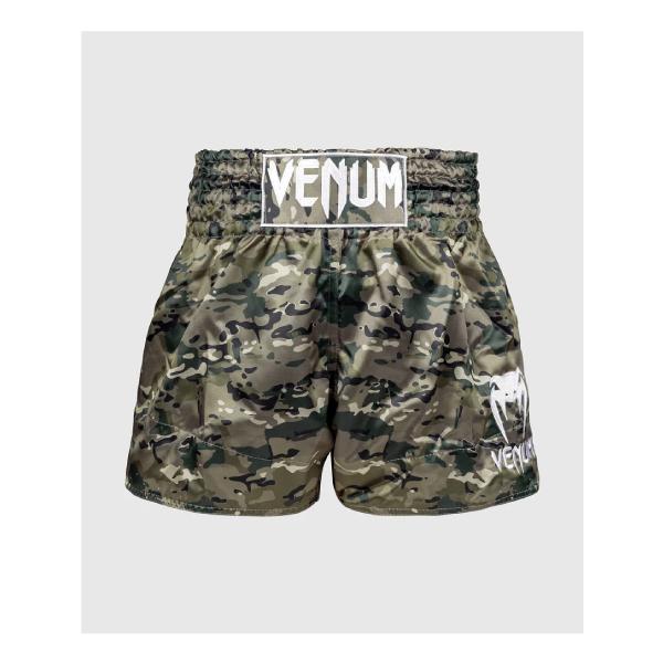 Venumクラシックムエタイショーツは、ムエタイ練習者の必需品です。タイ製のこのタイ・ボクシング・ショーツは、軽くて柔軟なポリエステルを使用。サイドのスリットにより、リング上での可動域が広がる。幅広の伝統的なベルトが腰回りをしっかりとサポー...