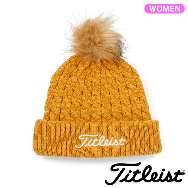 メーカー品番TH23WCKNP素材アクリル　100%原産国ベトナムプロフィールフェイクファーのポンポンが付いたケーブル編みニットビーニー。サイズレディスフリー(55〜57cm)