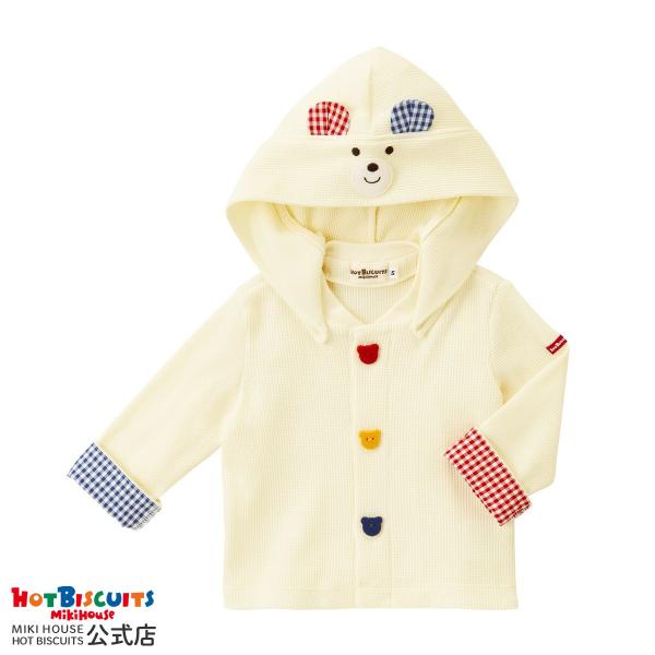 ミキハウス ホットビスケッツの顔ドンシリーズのパーカー。人気の顔ドンシリーズのワッフル素材パーカーです。フードについたくまのお顔とカラフルなボタンがポイント！合わせやすいアイボリーのお色で着回しバッチリ！袖口の折り返しがギンガムチェック柄で...