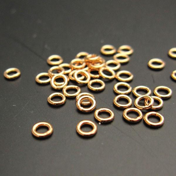 ゴールドフィルドの丸カン　クローズタイプです。（切れ目がありません。）ゴールドフィルドとは、金の層を高熱と圧力で素材（真鍮）に圧着したもので、その金の層の重量が素材を含む総重量の1/20以上の場合、ゴールドフィルド（金張り）と呼びます。14...