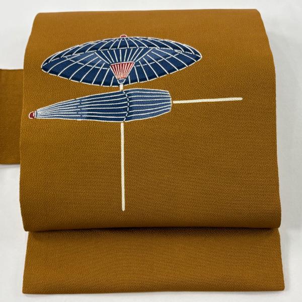 名古屋帯 逸品 栗山吉三郎 落款あり 番傘 縮緬 紅型 茶色 正絹 中古