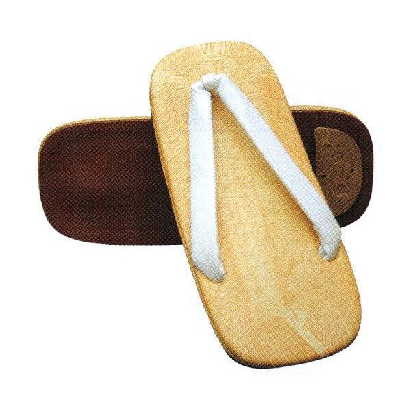 ベーシックな白鼻緒の雪駄です。台は、ノザキ表（竹を薄く裂いて編んだ伝統的な草履・雪駄表）をイメージした薄茶＆茶の変り縞模様のザラッとした感触のビニールです。鼻緒は白のビニール製です。男性用。底は、「ライト底」などと呼ばれる獣皮を模した合成皮...