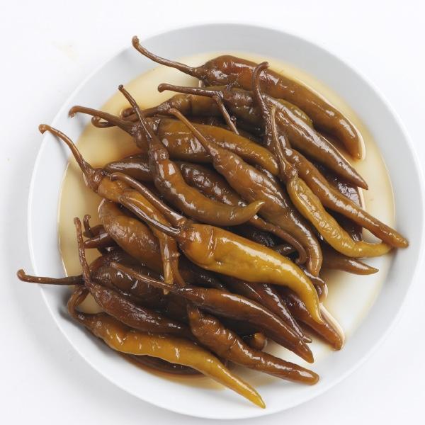 商品名　1180 韓国市場 唐辛子【醤油漬け】品目 漬物原材料名　青唐辛子、醤油、砂糖、米酢、キトサン／L-グルタミン酸ナトリウム、酒精、サッカリンナトリウム内容量　500g原産国名　中華人民共和国賞味期限　別途記載栄養成分表示（100g当...