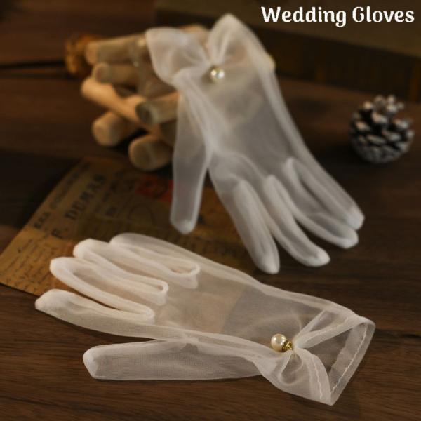 結婚式・パーティーなどのフォーマルシーンで大活躍♪エレガントなウエディンググローブです。【サイズについて】画像をご参照ください。【素材について】ポリエステル【カラーについて】生産ロットにより柄の出方や色の濃淡が異なる場合がございます。お使い...