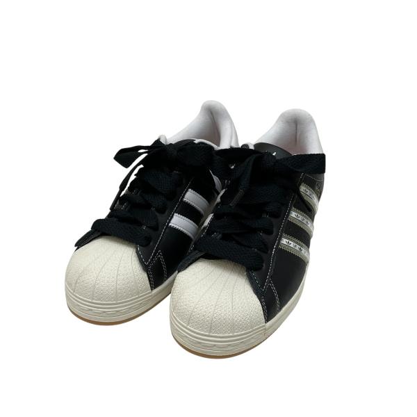 アディダス adidas SUPERSTAR KORN CBLACK TRANSL BETSCA スニーカー IH1313 ブラック サイズ：26.5