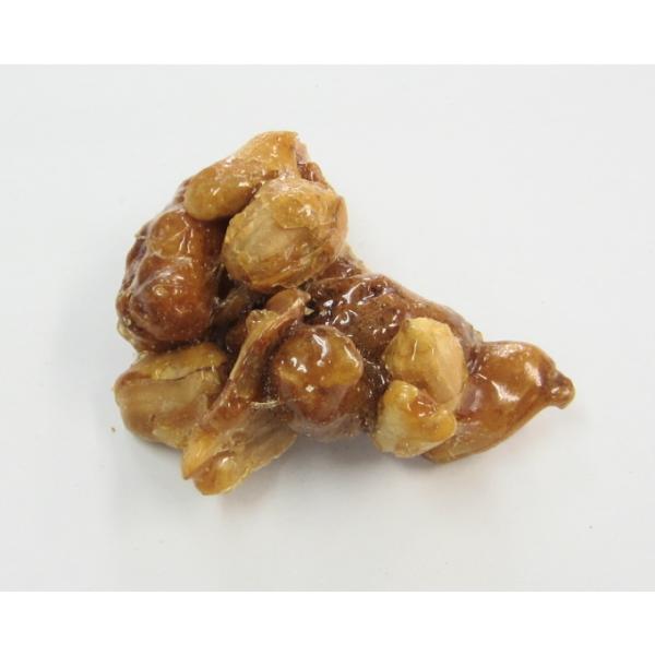 砂糖と水飴のまろやかな甘みの中にあられとピーナッツの風味が活きています。ピーナッツのことを南京豆とも呼ぶので、この商品名。懐かしい味わい。あられのたまりの味が砂糖の甘みを適当に押さえ食べ心地のよい味です。  原材料名：砂糖・落花生・モチ粉（...