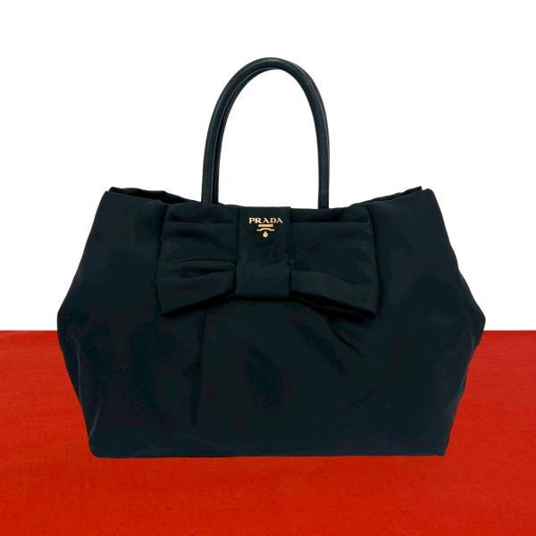 PRADA（プラダ） 極 美品 ロゴ 金具 リボン モチーフ ナイロン レザー
